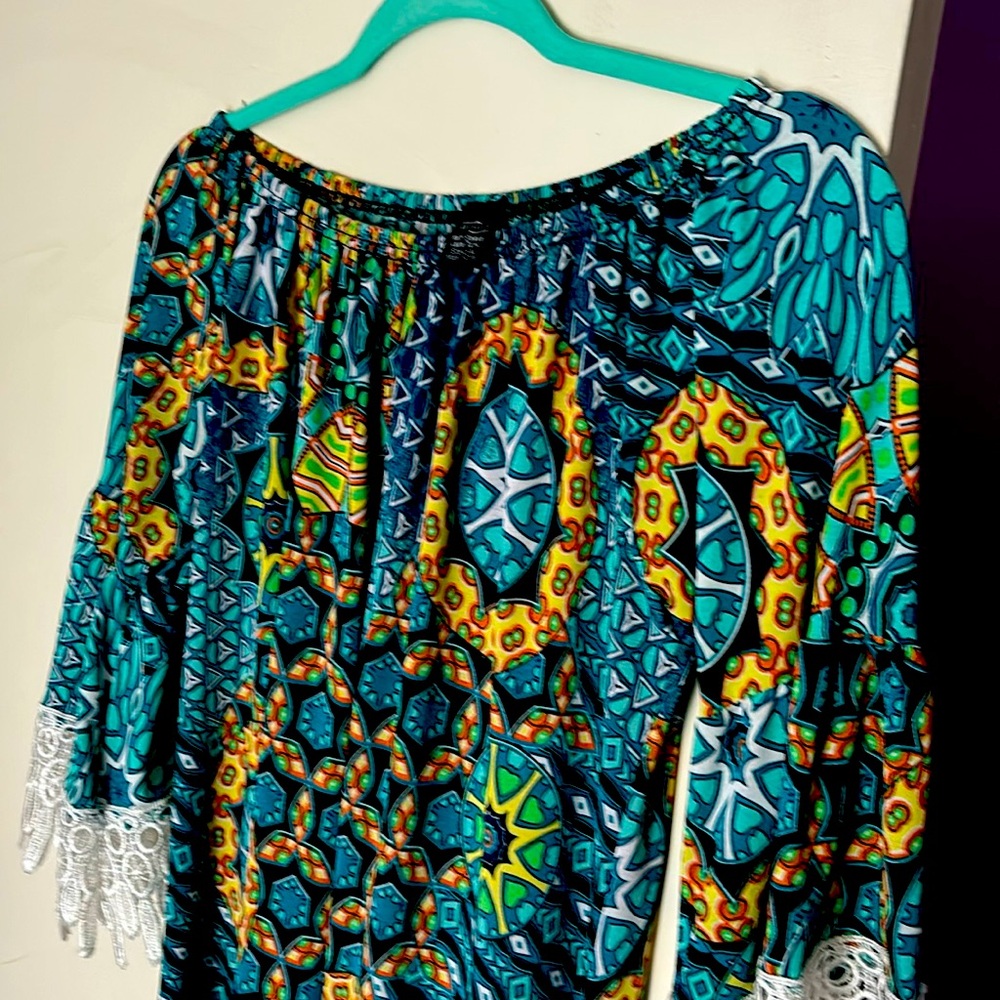 Great top or short dress made of polyester and spandex